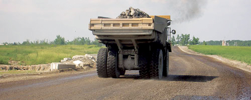 Mining haul truck on a dust-controlled road