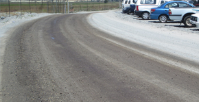 Treated unpaved road with dust control
