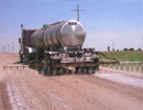 Water tanker truck applying dust suppression